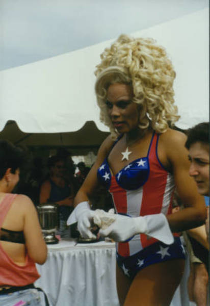 RuPaul at March on Washington in red, white, and blue swimsuit