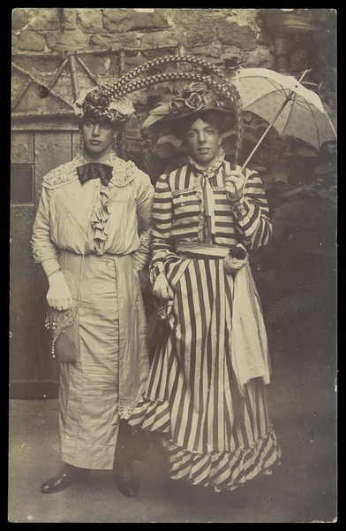 Download the full-sized image of Two amateur actors in drag, wearing elaborate costume. Photographic postcard, 191-.