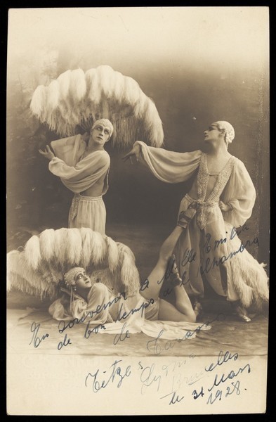 Download the full-sized image of Three actors perform on stage. Photographic postcard, 1928.