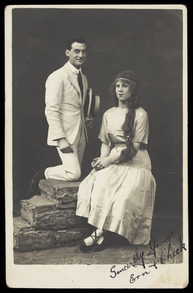 Download the full-sized image of Ern and Chick, two actors, Chick in drag, pose in summer attire. Photographic postcard, ca. 1918.