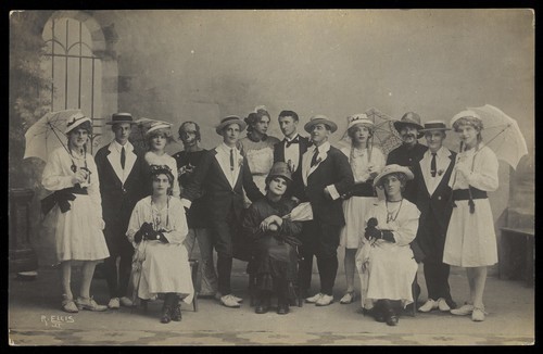 Download the full-sized image of Servicemen in Malta performing a play, some in drag. Photographic postcard by R. Ellis, ca. 1918.
