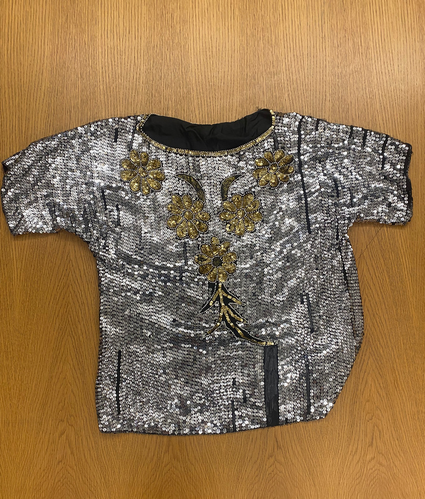 Download the full-sized PDF of Photo of a Sequined Silver Blouse