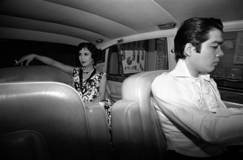 Download the full-sized image of Akihiro Miwa Riding in Her Rolls Royce in Tokyo Nightclub District (1980)