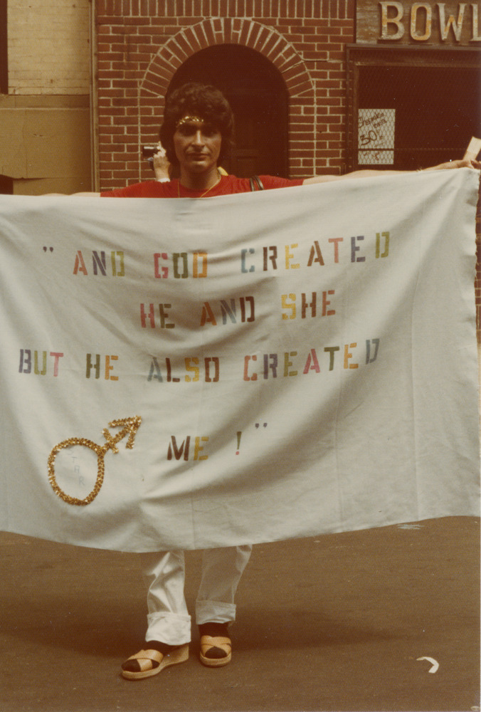 Download the full-sized image of Sylvia Rivera holding banner at Christopher Street Liberation Day parade, 1983