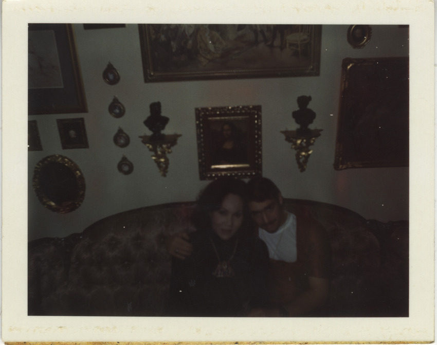 Download the full-sized image of Victoria Fernandez with companion on couch