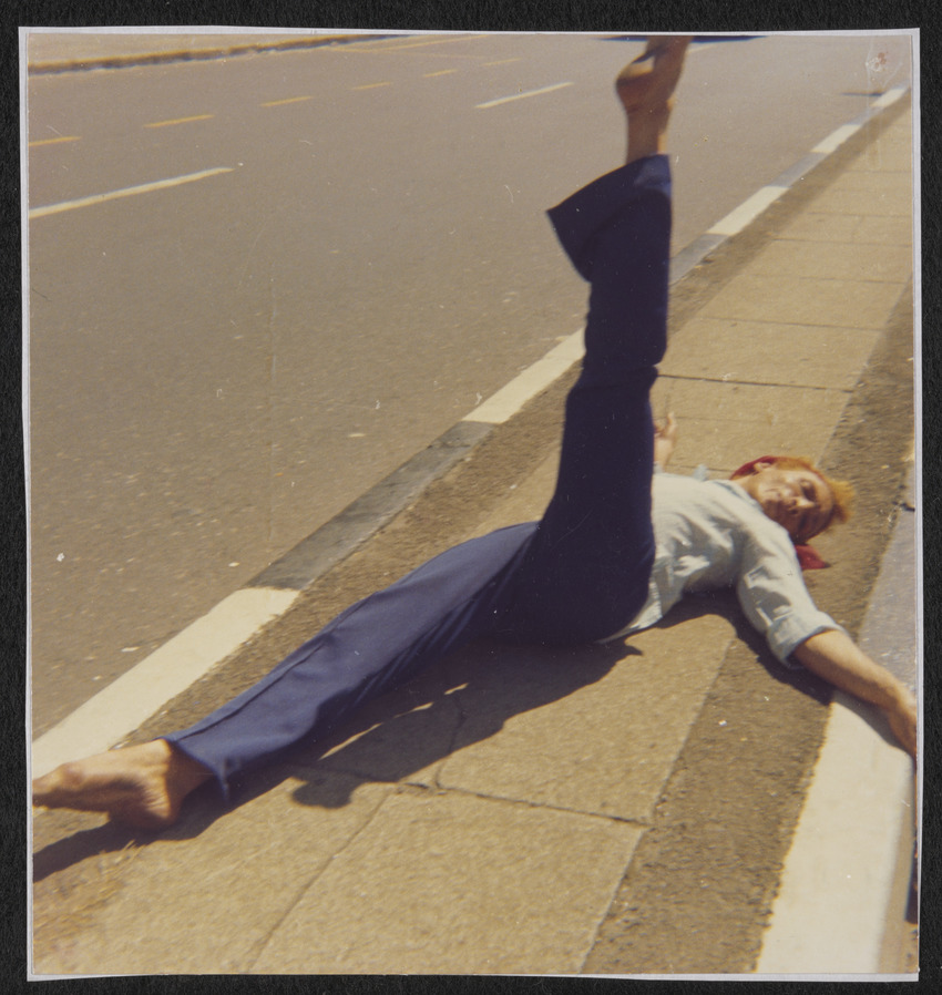 Download the full-sized image of Kewpie Lying on a Sidewalk