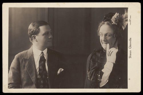 Download the full-sized image of Two characters played by Shaun Glenville, one in male and one in female garb. Photographic print by Fielding, 191-.