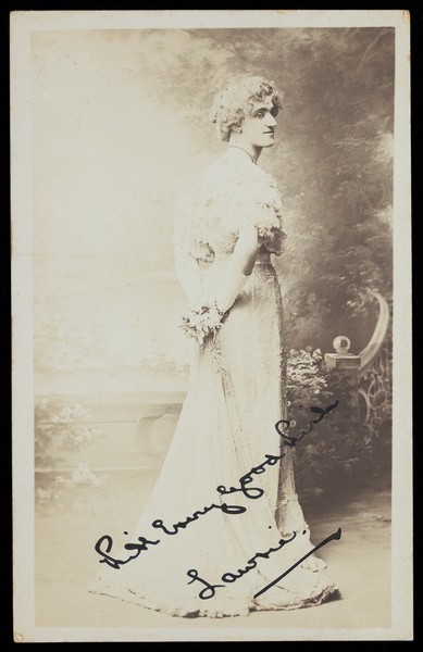 Download the full-sized image of Lawrie in drag. Photographic postcard, ca. 1910.