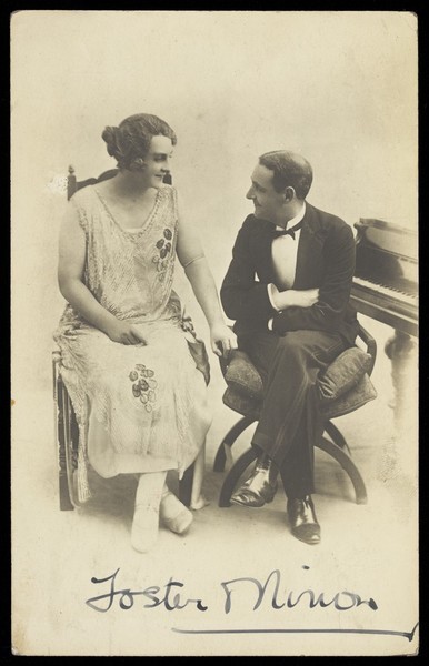Download the full-sized image of Foster and Ninon in character, having a conversation. Photographic postcard, 192- (?).