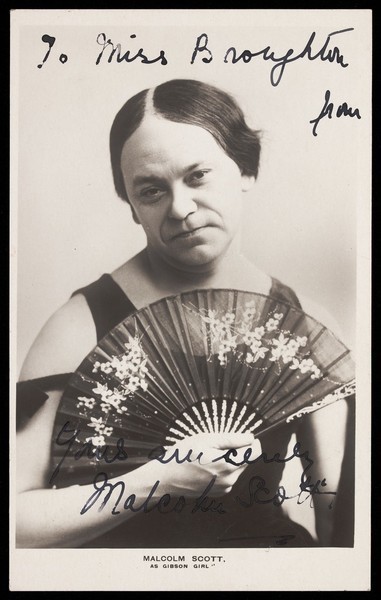 Download the full-sized image of Malcolm Scott in character as a "Gibson Girl". Photographic postcard, 1908.