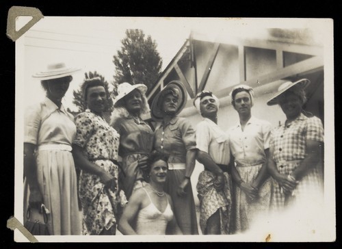 Download the full-sized image of Men in drag pose outside dressed in summer attire. Photograph, 194-.
