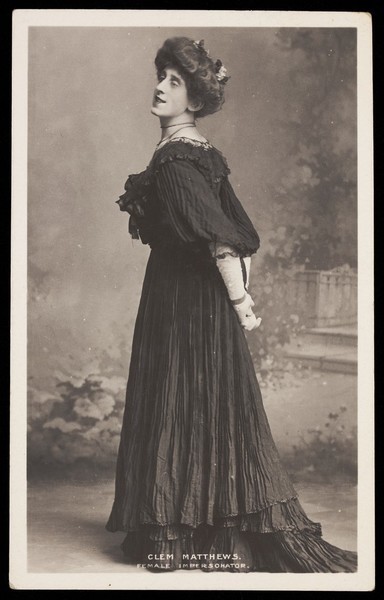 Download the full-sized image of Clem Matthews in drag. Photographic postcard, ca. 1910.