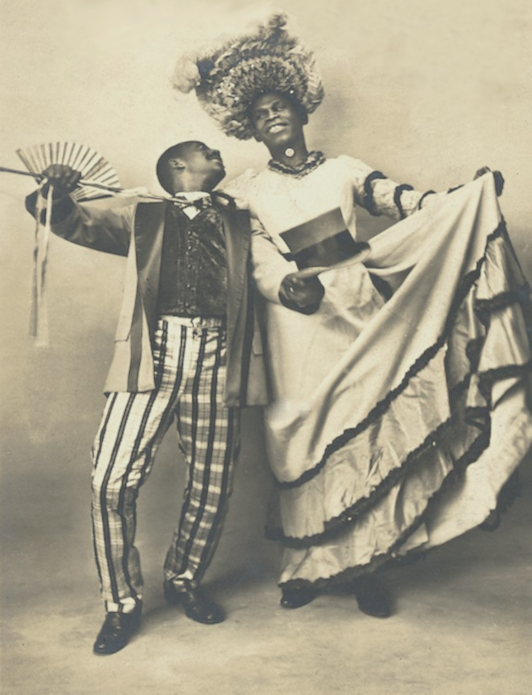 Download the full-sized image of Jack Brown Stands in Drag Beside Dance Partner Charles Gregory with Arms Open Wide