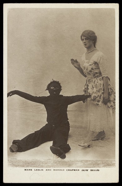 Download the full-sized image of Harold Chapman in drag poses with Mark Leslie dressed as a Golliwog, in an act for the Bow Bells. Photographic postcard, 191-.