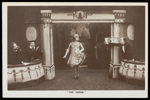 Download the full-sized image of Soldiers, one in drag, performing in the concert party "The Goods". Photographic postcard, 1918.