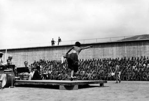 Download the full-sized image of Male performer in female dress, dancing on stage, San Quentin Little Olympics Field Meet, 1930