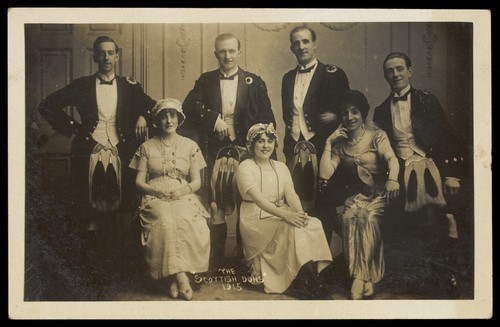 Download the full-sized image of Actors, one in drag, pose as "The Scottish Dons". Photographic postcard, 1915.
