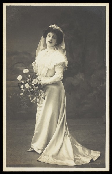 Download the full-sized image of Arthur Grayson, dressed as a bride, for "The Jollity Boys". Photographic postcard, 1909.