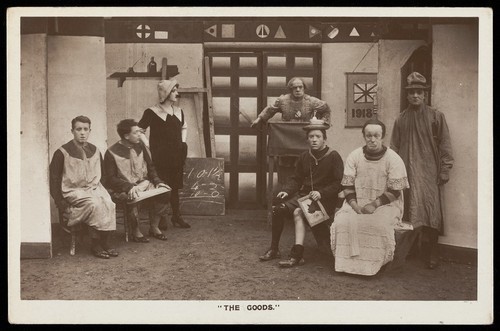 Download the full-sized image of Soldiers, some in drag, performing in the concert party "The Goods". Photographic postcard, 1918.
