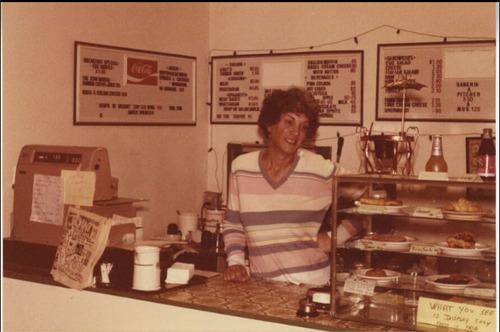 Download the full-sized image of D'Anne behind the counter at Cafe Denise