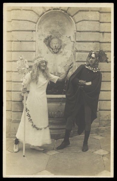 Download the full-sized image of Two British servicemen, one in drag, between shows in Genoa. Photographic postcard, 1916.