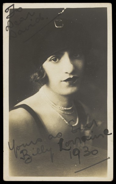 Download the full-sized image of Billy Lorraine in drag, posing for a portrait. Photographic postcard, ca. 1930.