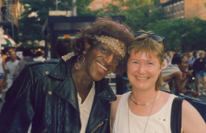 Download the full-sized image of A Photograph of Marsha P. Johnson Wearing a Gold Headband, Leather Jacket and White Shirt at New York City Gay Pride 1992
