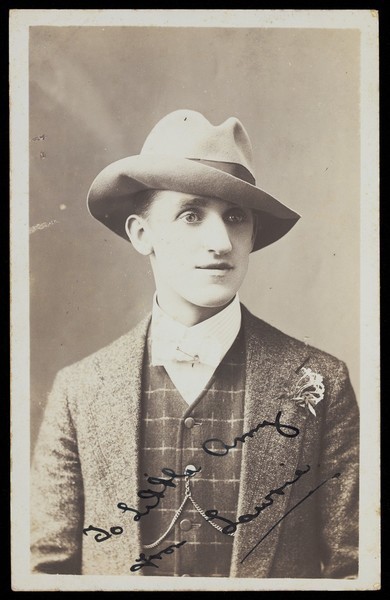 Download the full-sized image of Lawrie in male clothes. Photographic postcard, ca. 1910.