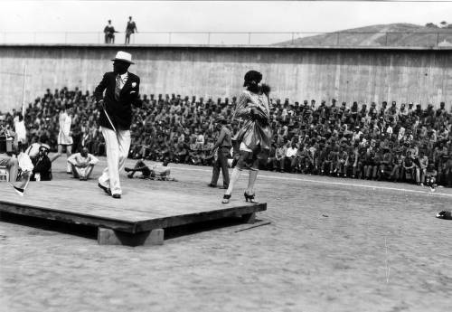 Download the full-sized image of Stage entertainment, including a male dancer in female dress, San Quentin Little Olympics Field Meet, 1930 