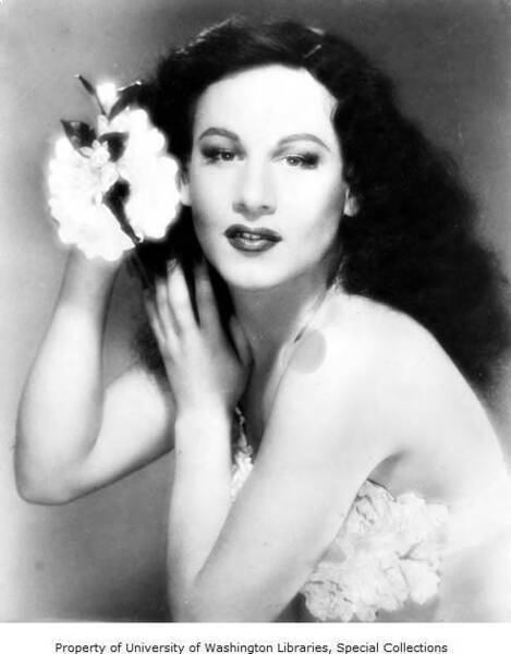 Download the full-sized image of Portrait of Paris DeLaire with flowers