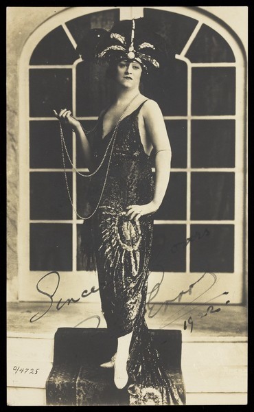 Download the full-sized image of Bert Errol, in character, wearing a shiny black dress. Process print, 1922.