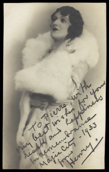 Download the full-sized image of Henry, a man in drag, wearing a white fur stole. Photograph, 1933.