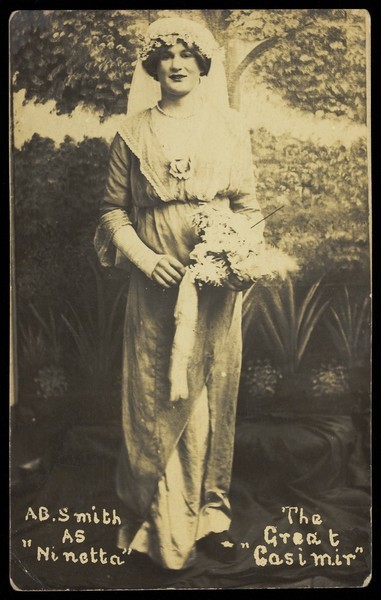 Download the full-sized image of A sailor on H.M.S St. Vincent, in drag as a bride in a performance of 'The Great Casimir'. Photographic postcard, 1918.