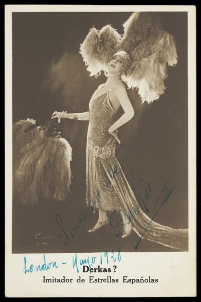 Download the full-sized image of "Derkas ?", dressed in drag, on stage. Photographic postcard, 1928.