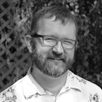 Black and white photo of Jonathan Alexander outside